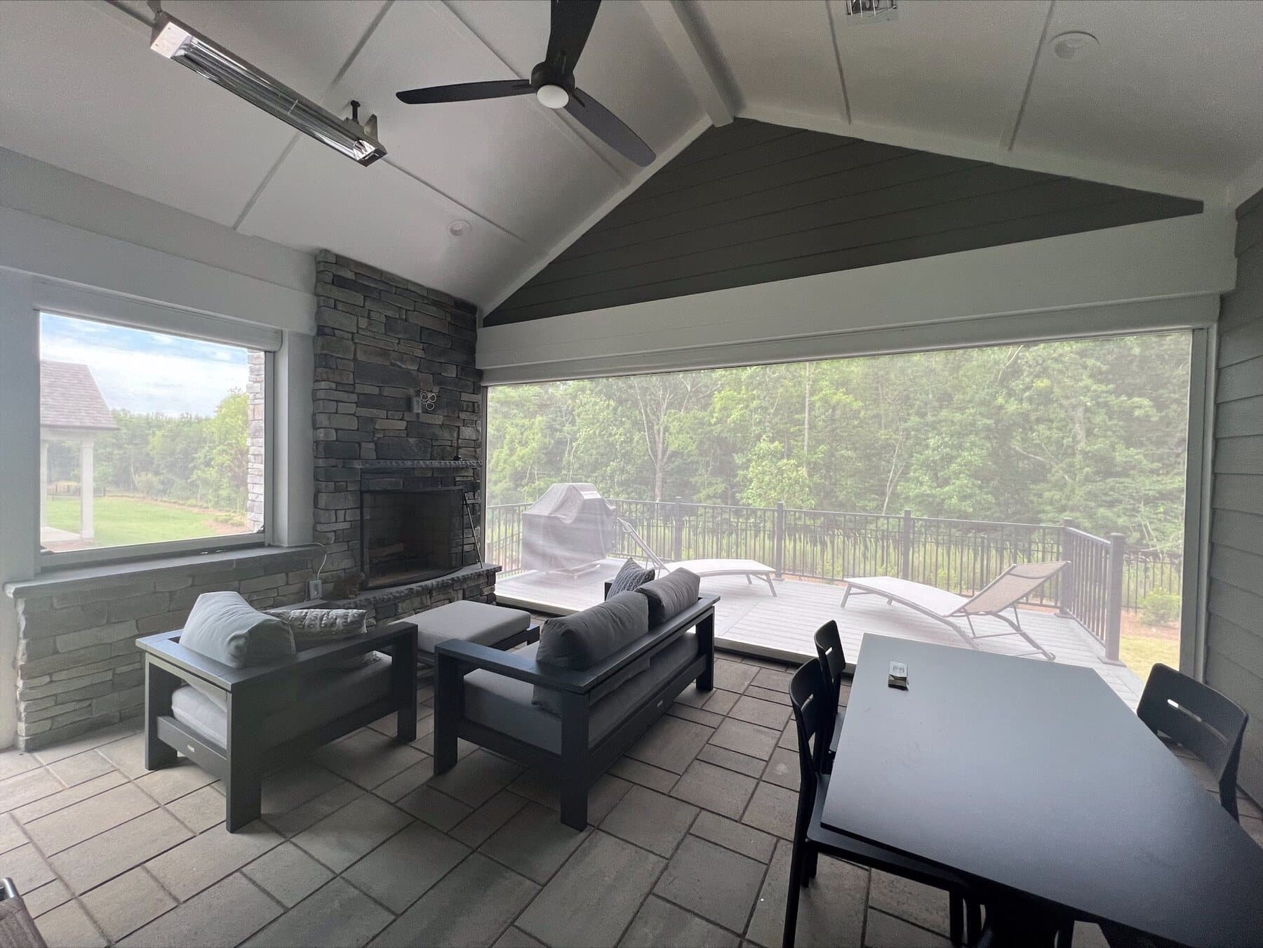 Retractable insect screen protecting a furnished residential porch